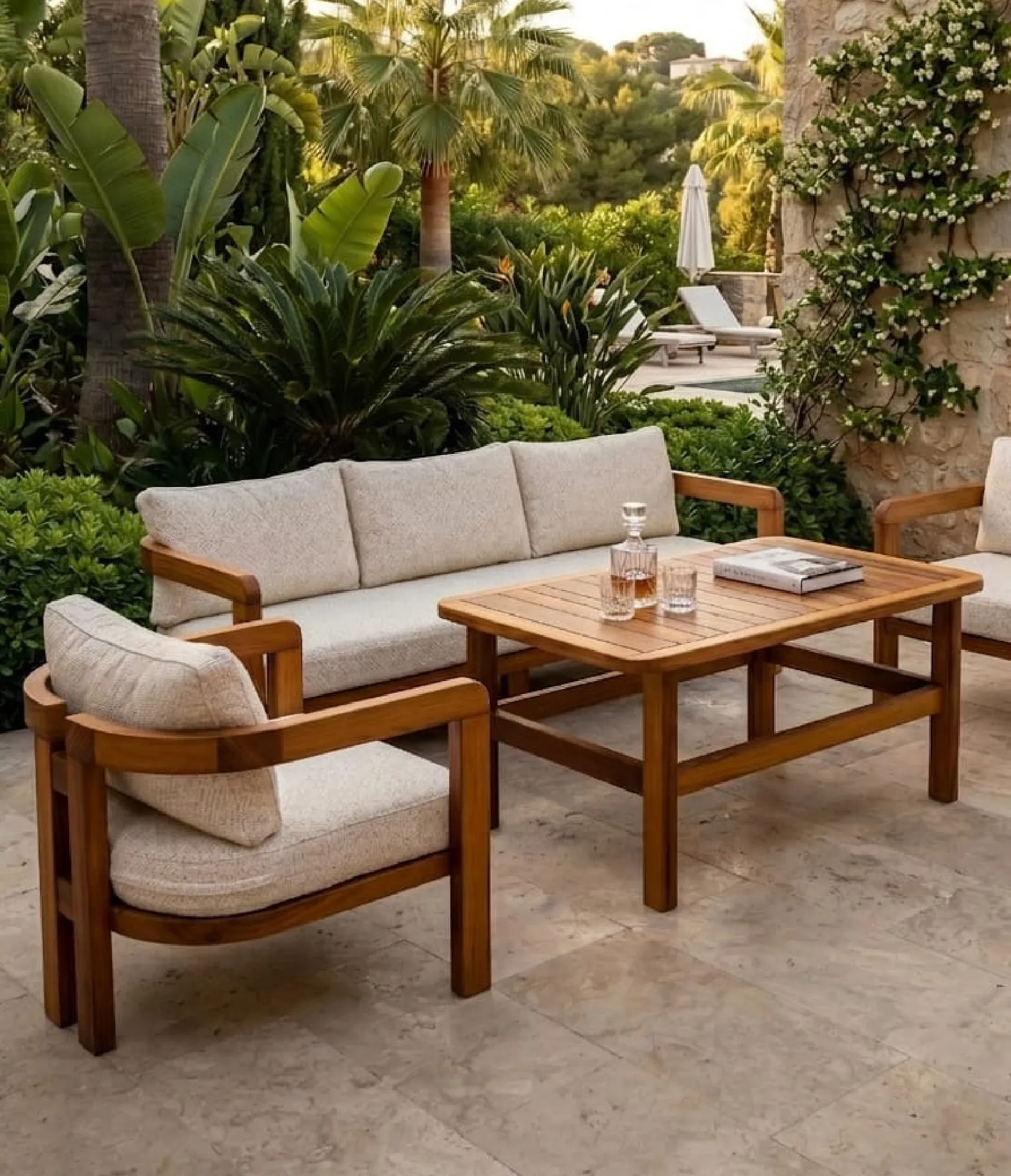 Monaco solid iroko lounge set in a tropical garden